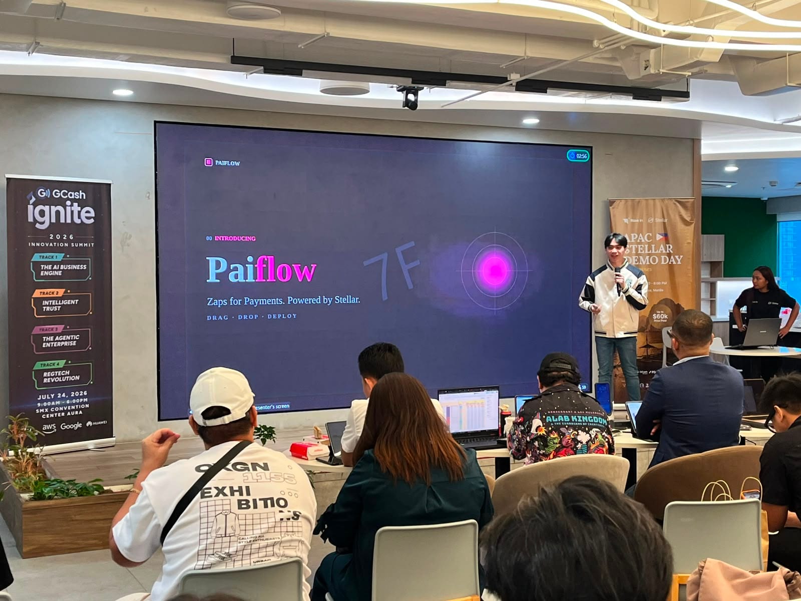 The Paiflow title slide — "Zaps for Payments. Powered by Stellar." — on screen during its Demo Day pitch