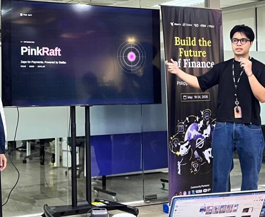 Carl Macabales pointing at the Pink Raft title slide during the Build on Stellar Philippines Hackathon final pitch