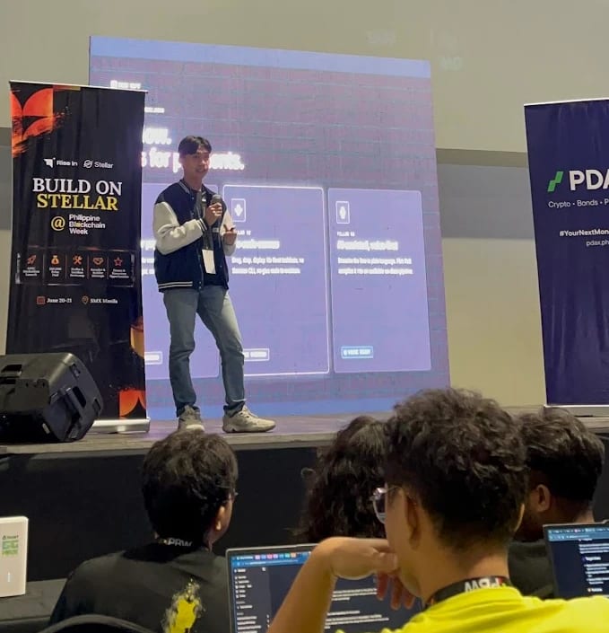 Mychal Pejana pitching Paiflow on the Build on Stellar stage at Philippine Blockchain Week 2026, SMX Manila